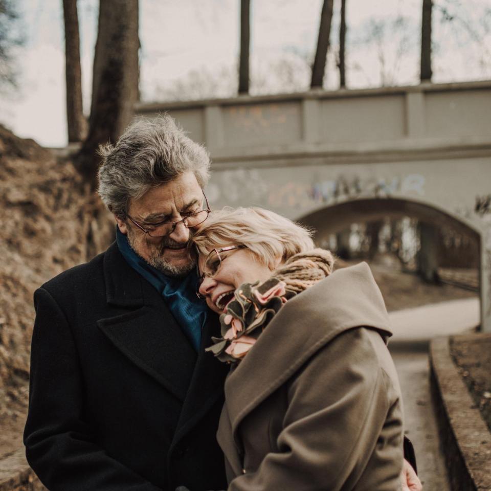 Older couple hugging 